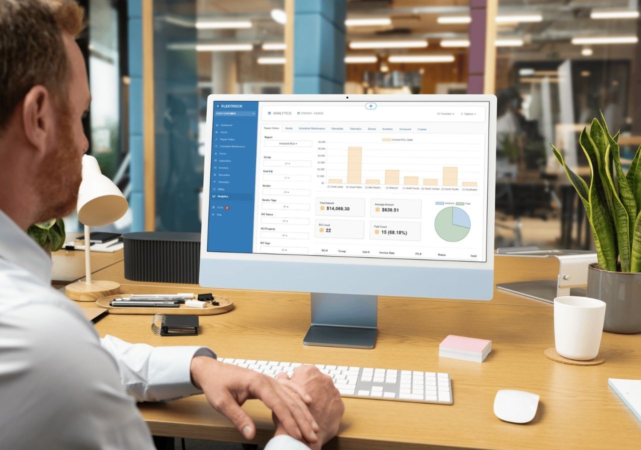 Fleet manager reviewing the Fleetrock analytics dashboard showing repair order costs and trends